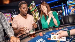 Filipino player accessing wk77 live casino table on a smartphone